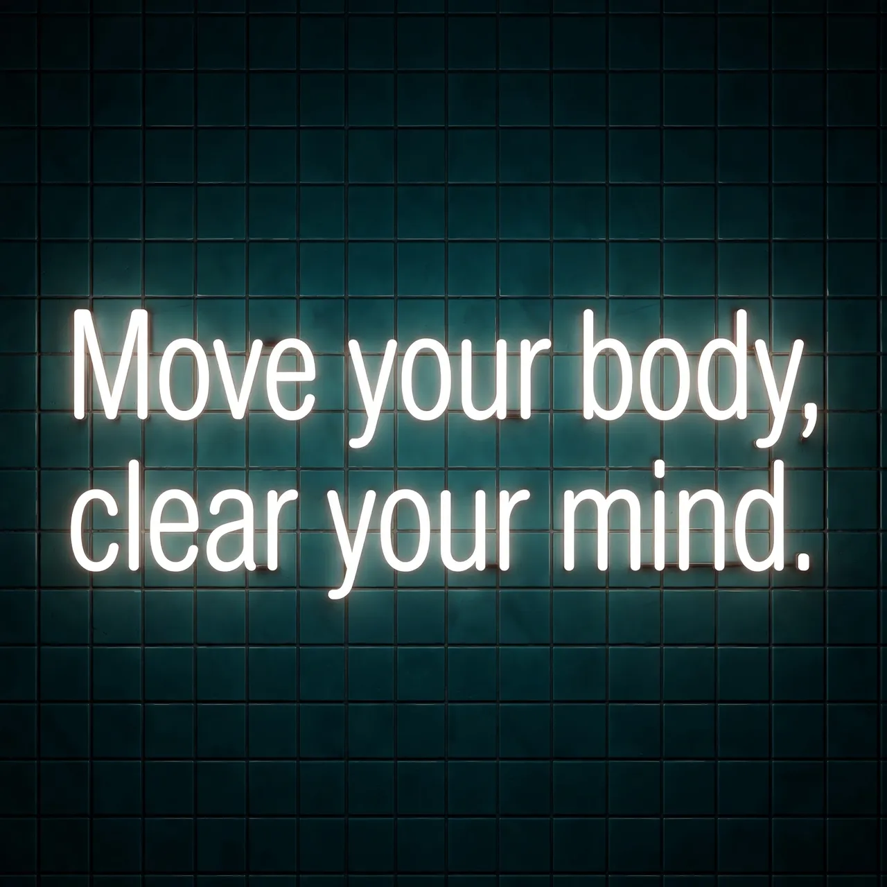 Glowing white neon sign reading "Move your body, clear your mind." mounted on a dark teal tiled wall