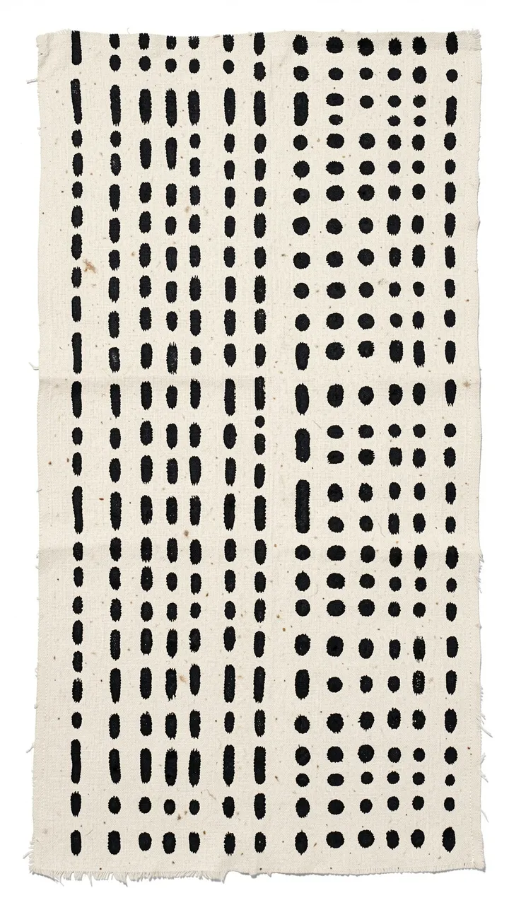 Hand-painted black vertical rows of dashes and dots on frayed off-white woven mud cloth