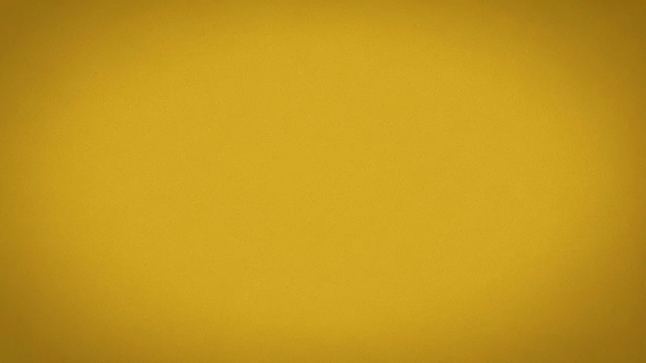 Fine-grained mustard yellow background with a soft, subtle edge vignette