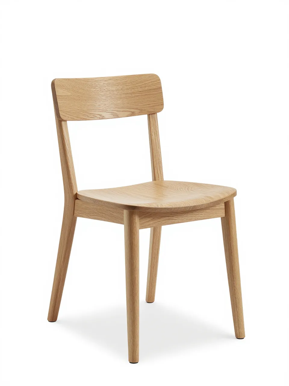 A minimalist bentwood natural oak dining chair stands isolated on a pure white studio background.