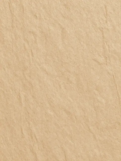 Full frame close-up of coarse natural tan bark-fiber paper with subtle surface streaks