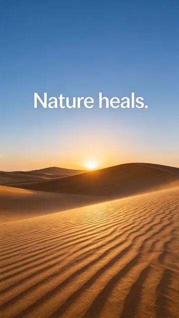 Golden desert sand dunes at sunset with clear blue sky displaying the text "Nature heals."