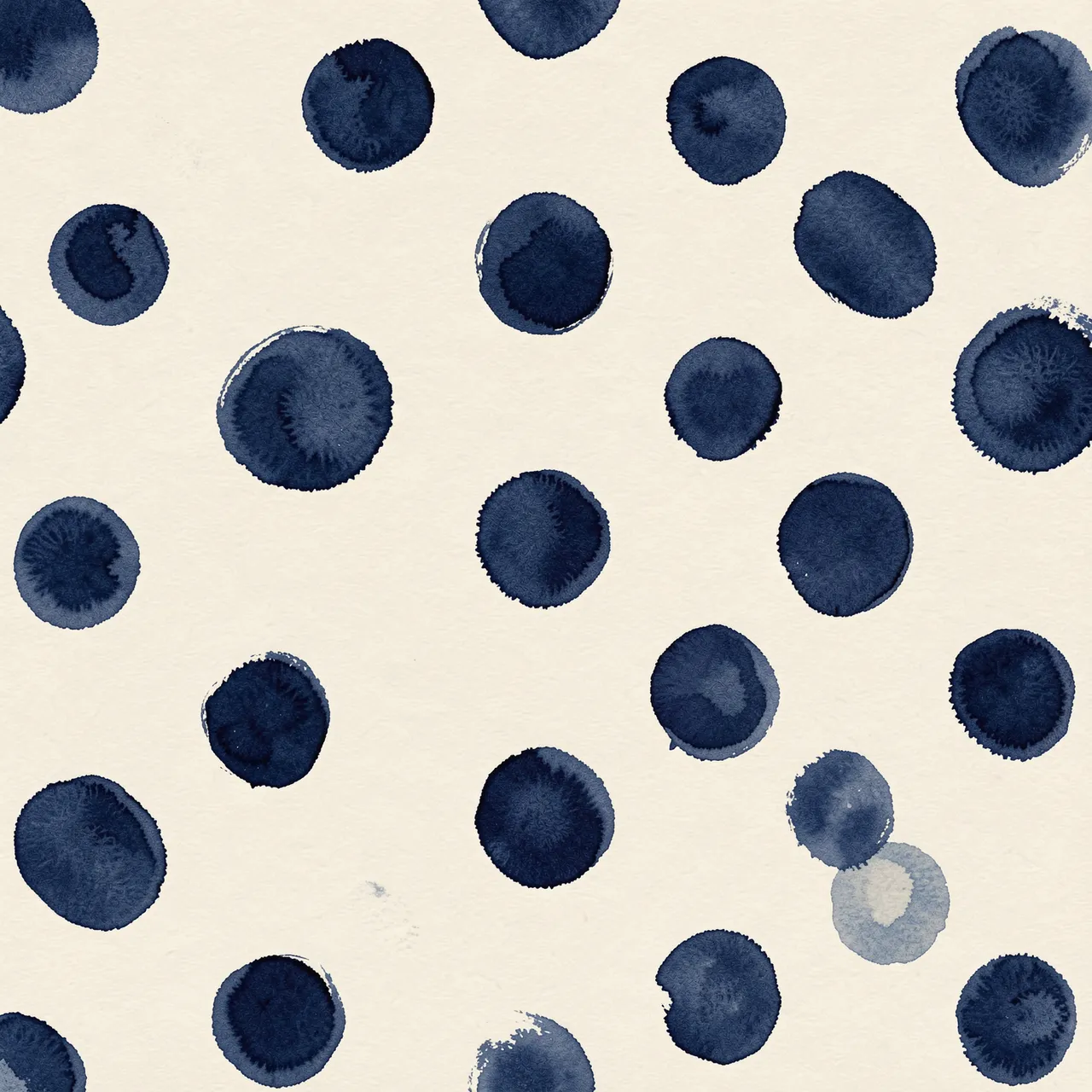 Loosely spaced wobbly navy gouache polka dots on a creamy off-white background