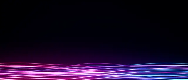Glowing pink, purple and blue neon light trails stream along the bottom edge of a deep dark empty frame.