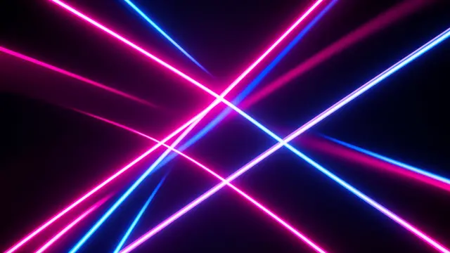 Crossing neon pink and bright blue light beams glow against a dark black background
