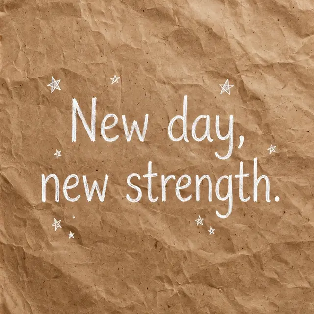 White hand-drawn text reading "New day, new strength." with small star doodles on crumpled brown kraft paper