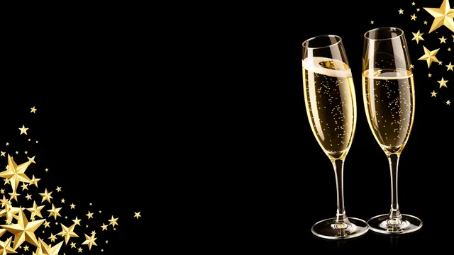 Two filled champagne flutes with sparkling wine sit on a black background framed by gold stars at opposite corners with