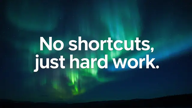 Bold white text reading "No shortcuts, just hard work." over a dark night sky with green and teal aurora borealis.