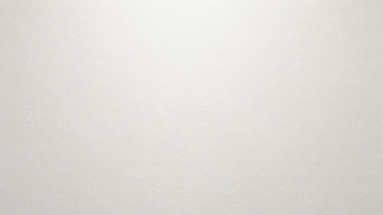 Smooth off-white paper surface with fine grain texture and soft top lighting