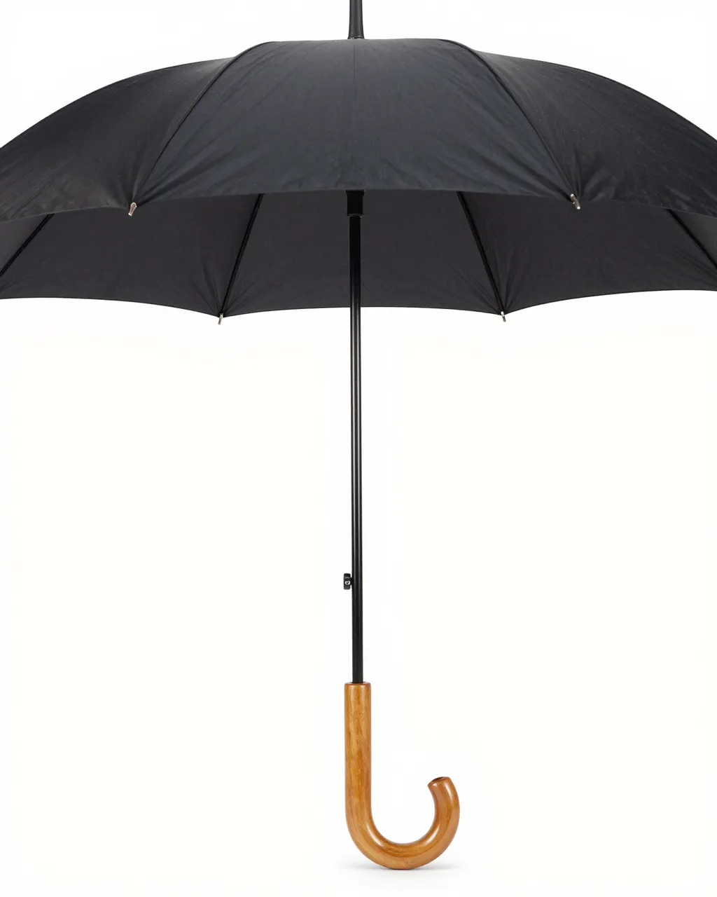 Open black umbrella with curved wooden handle isolated on a plain white studio background