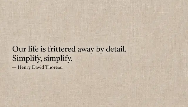 Black serif Thoreau quote set left on a warm beige linen textured desktop wallpaper reading "Our life is frittered away by