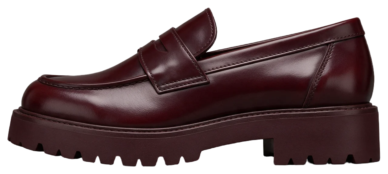 Side profile view of a single glossy oxblood leather chunky-soled penny loafer