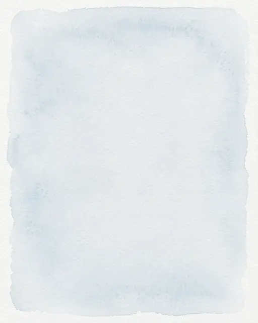 Cold press watercolor paper with a soft pale blue wash fading gently toward the edges