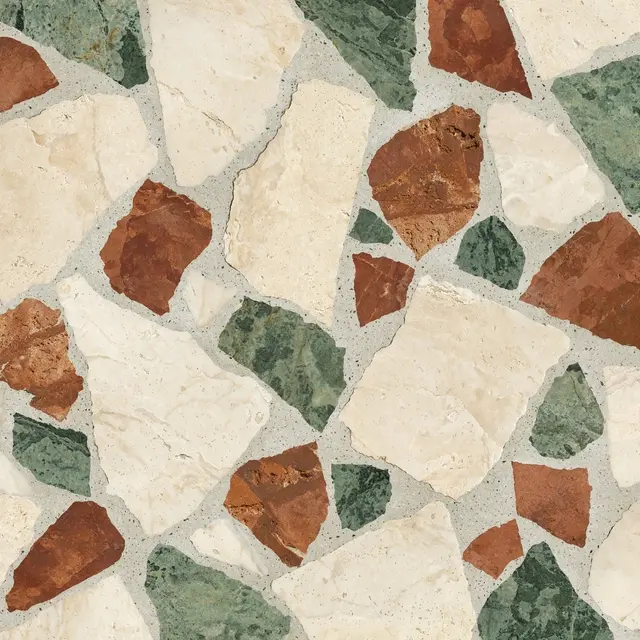 Full frame close-up of palladiana terrazzo with irregular cream, rust and green stone chunks set in light gray mortar.