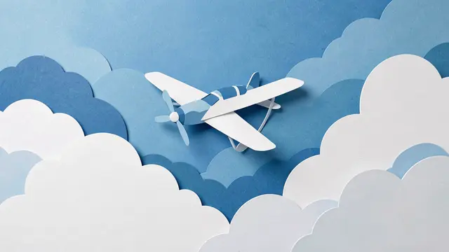 Layered paper cut illustration of a small propeller airplane flying above fluffy clouds in blue sky tones