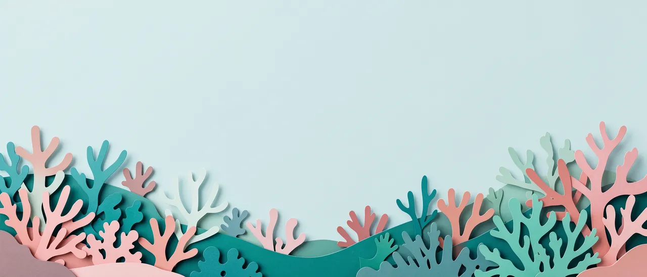 Layered paper cut coral decoration lines the bottom of a pale teal empty header background