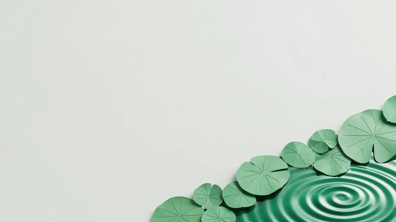 Paper craft lily pads and jade ripples sit at the bottom right of an empty pale background