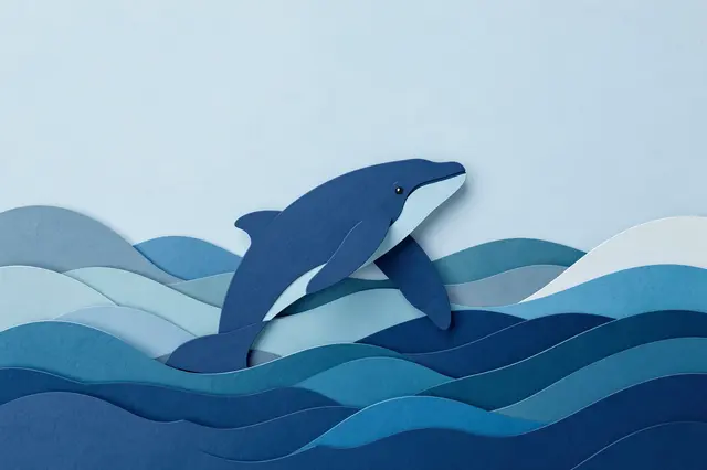 Layered paper cut illustration shows a leaping whale rising from stylized ocean waves with empty light blue sky above.