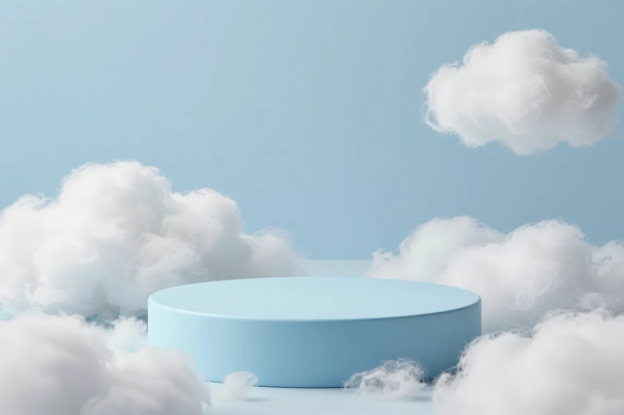 A smooth round pastel blue product podium sits surrounded by fluffy cotton-like clouds against a soft light blue background