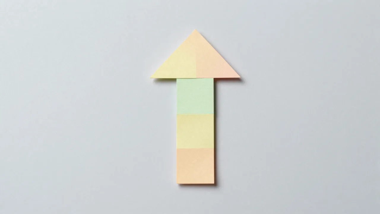 An upward-pointing arrow assembled from small pastel paper pieces sits on a pale gray background