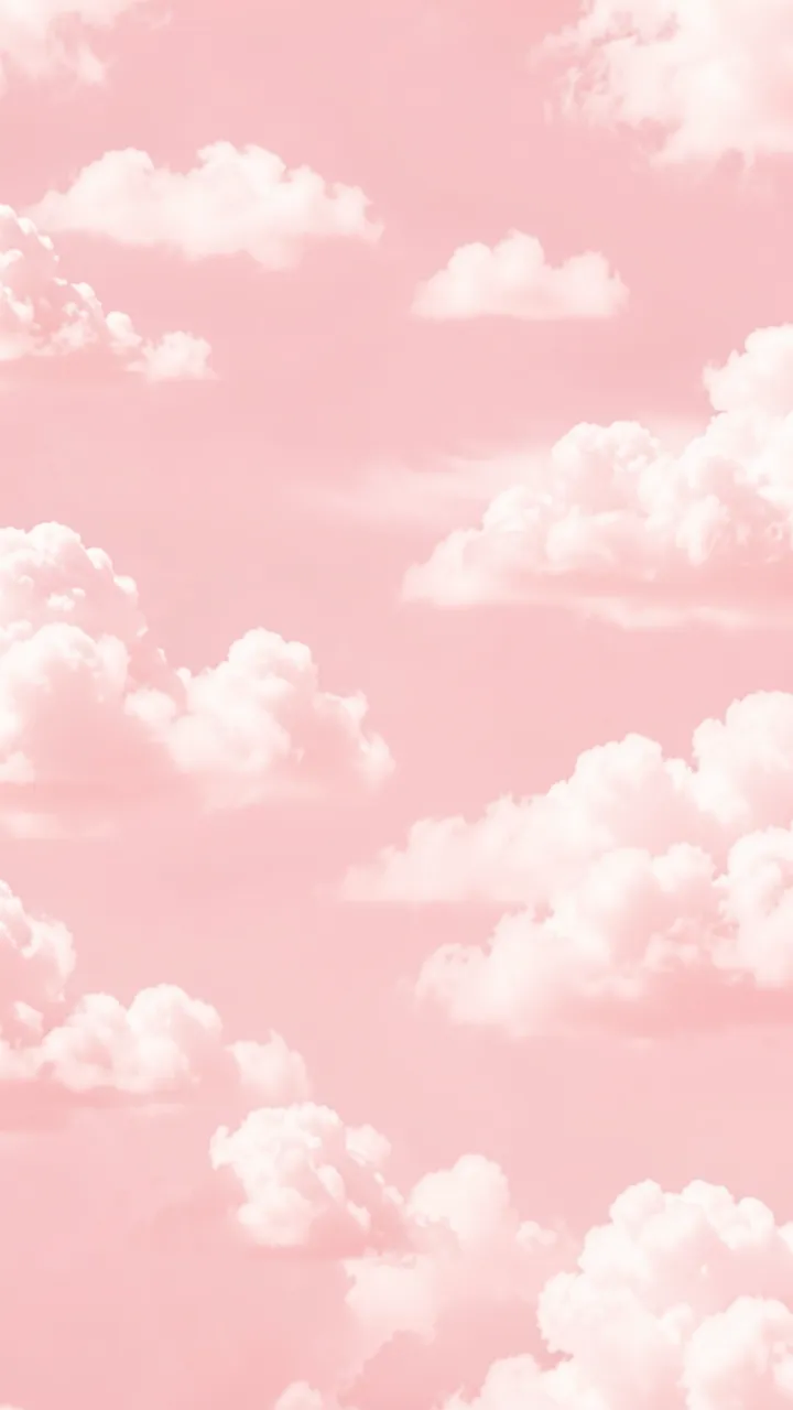 Vertical soft pastel pink sky dotted with fluffy white cumulus clouds