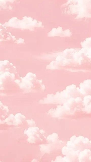 Vertical soft pastel pink sky dotted with fluffy white cumulus clouds