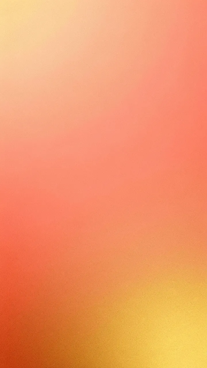Vertical grainy soft gradient blending peach, coral and warm gold tones