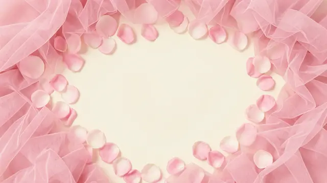 A decorative border of soft pink tulle and rose petals surrounds an empty pale ivory center with copy space