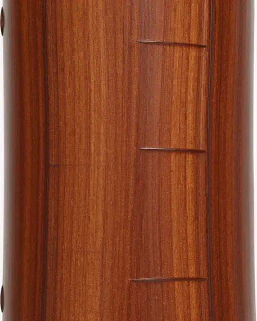 Full frame close-up of smooth polished cherry wood with carved horizontal linear details and warm brown grain