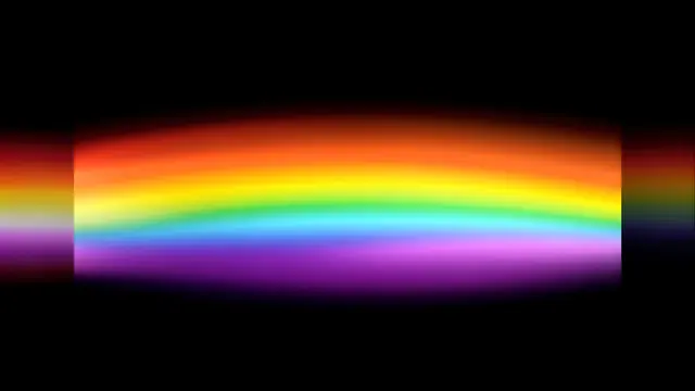 Soft blurred spectral rainbow band sits against a solid pure black background