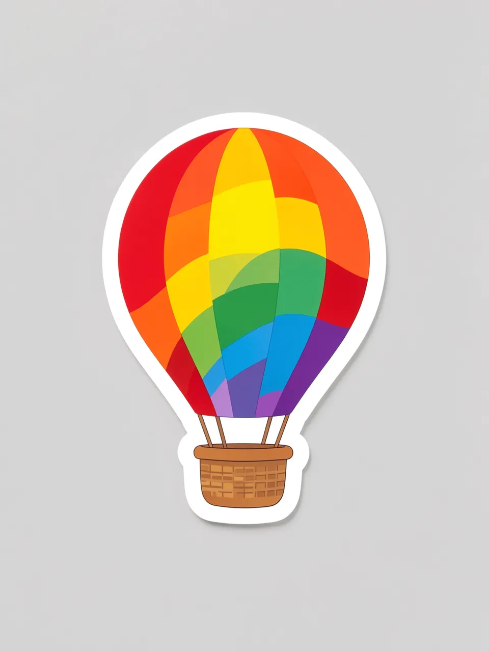 A die-cut sticker of a rainbow striped hot air balloon with a thick white border rests on a light gray background