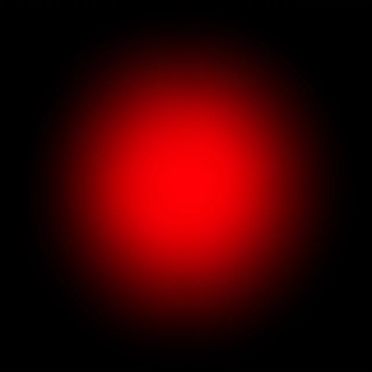 A soft blooming red light leak fades gently into a solid pure black background