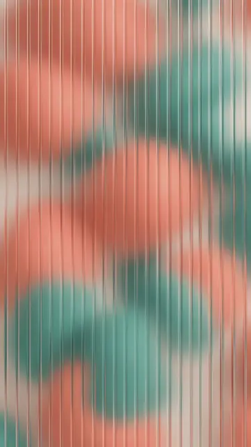 Blurred coral and teal soft shapes seen through vertical ribbed frosted glass