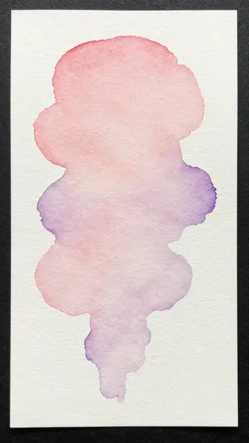 A vertical watercolor paper with a blended wet-in-wet rose and lilac ink blot centered on textured white stock.