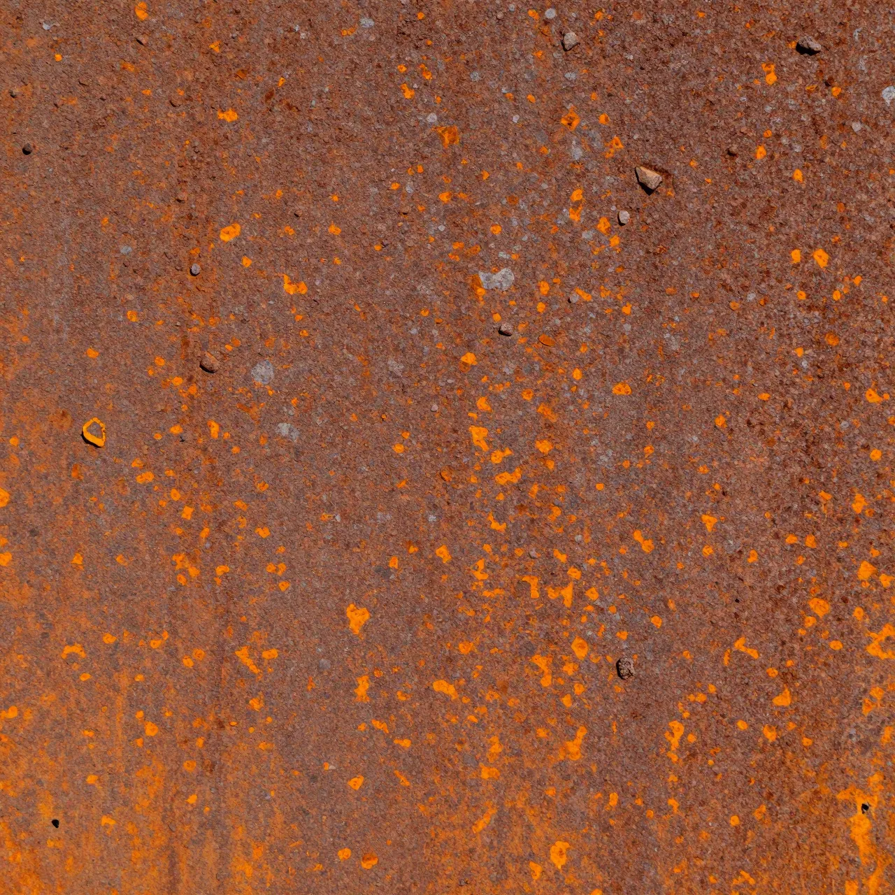 Full frame close-up of pitted rusted steel with flaking orange oxide scale and small embedded particles