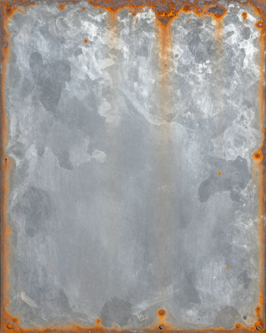 Full frame close-up of weathered sandblasted steel with patchy gray primer and orange rust blooms along the edges.