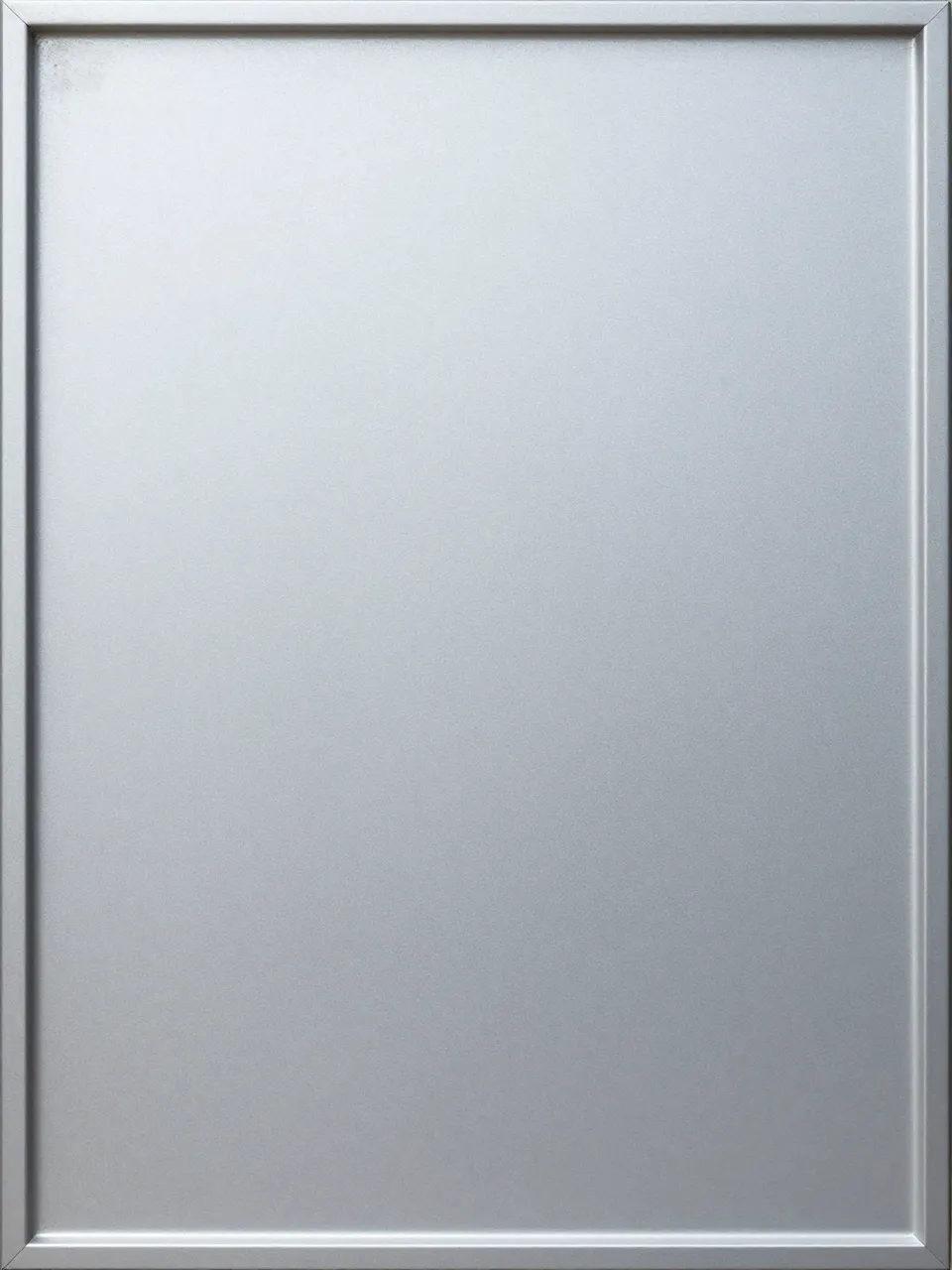Full frame close-up of a fine matte frosted sandblasted aluminum panel with a thin raised border