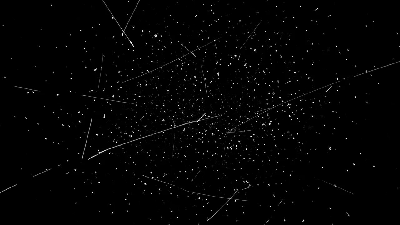 Pure black background scattered with fine white dust specks and thin short hairline scratches