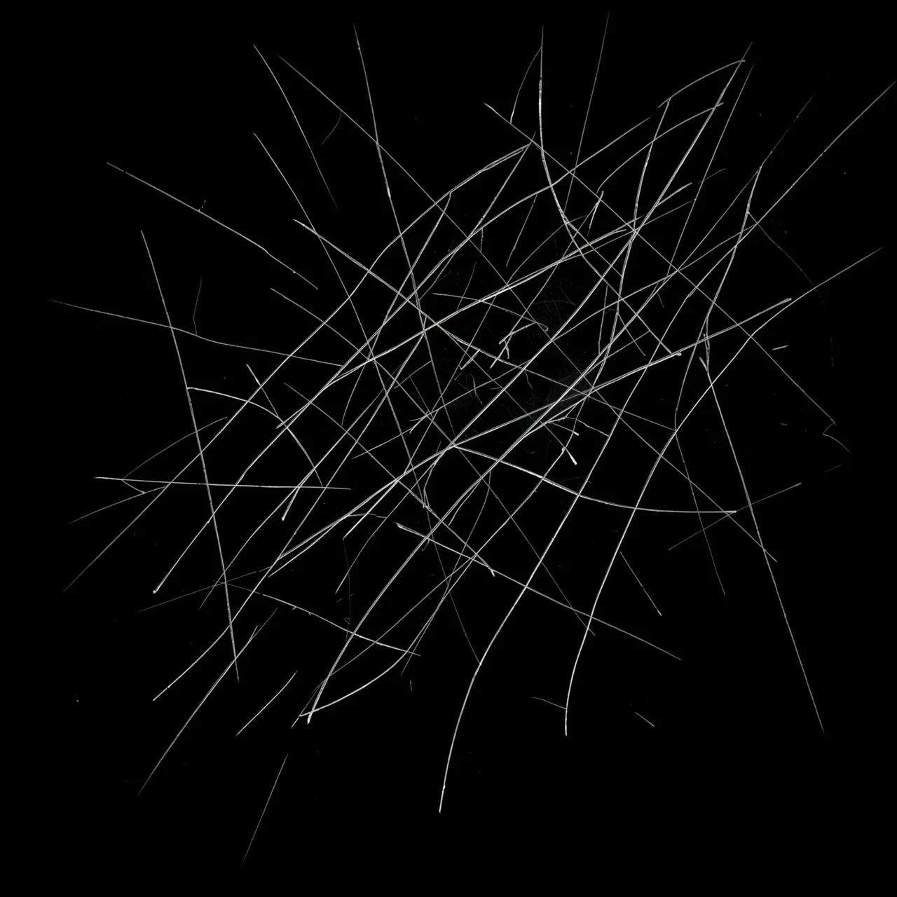 Fine intersecting light scratches appear across a solid pure black background