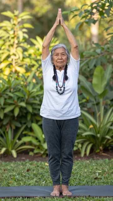 Elderly Indigenous woman holds a standing yoga pose on a mat in a sunlit garden