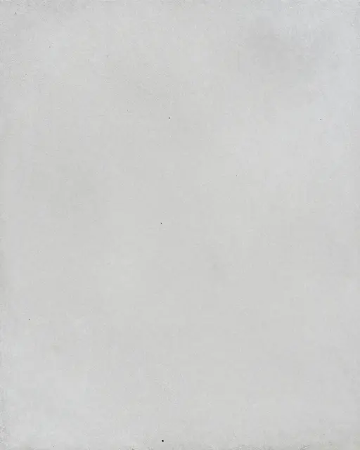 Full frame view of an evenly roughened pale gray shot-blasted concrete surface under flat light