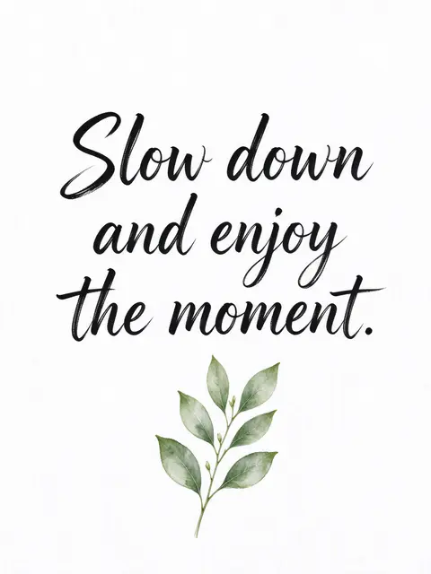 Black brush lettering reading "Slow down and enjoy the moment." paired with a small green leaf sprig on textured white