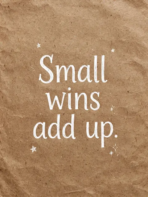 White hand-drawn lettering reading "Small wins add up." with tiny doodled stars on brown crumpled kraft paper