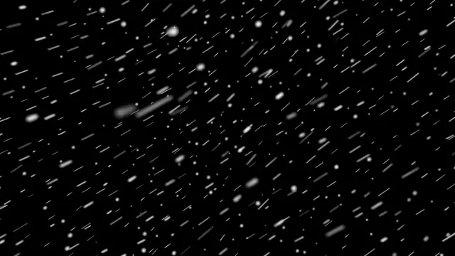 Falling snow with short motion streaks appears against a solid pure black background