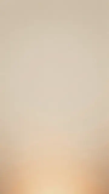 Vertical soft beige gradient background with a warm hazy glow at the bottom and fine subtle grain