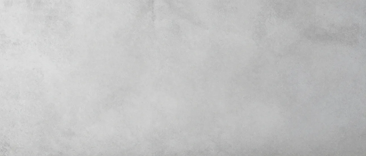 Wide, subtle textured soft gray concrete background with gentle tonal variation