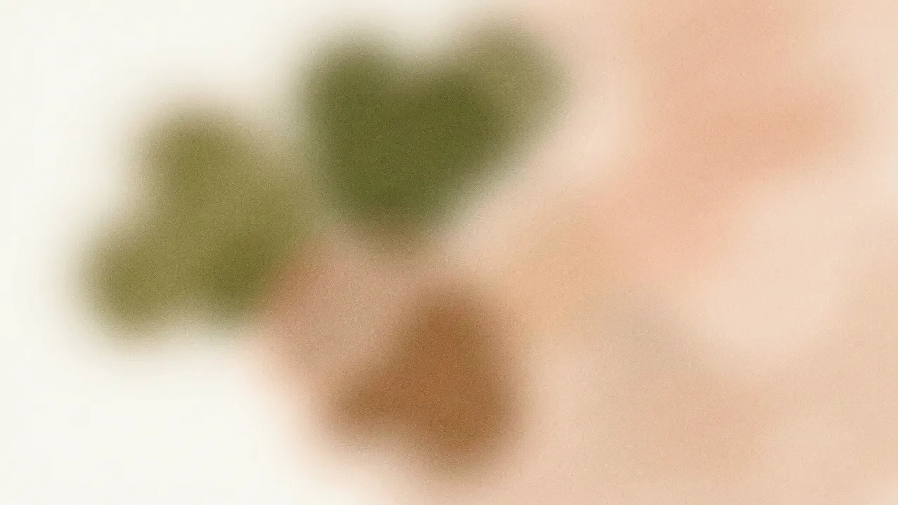 Blurred grainy abstract shapes in muted olive, peach, and warm brown tones