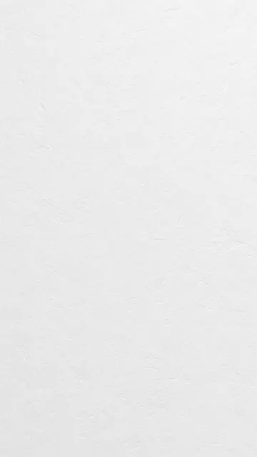 Full frame vertical shot of a subtle textured soft white paper surface