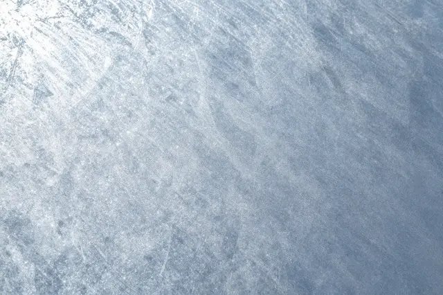 Full frame close-up of a spangled, brushed galvanized steel sheet surface