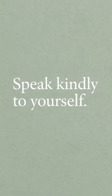 Centered white serif text reading "Speak kindly to yourself." on a soft sage green grainy background